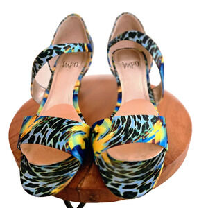 Impo strappy sandals feature a colorful, blue and yellow animal print design 7